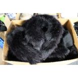 A box of Phaze Clothing - faux fur cloaks