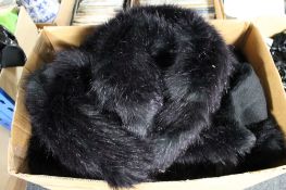 A box of Phaze Clothing - faux fur cloaks