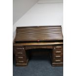 An Edwardian oak roll top desk CONDITION REPORT: 125cm high by 153cm wide by 75cm