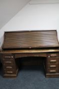 An Edwardian oak roll top desk CONDITION REPORT: 125cm high by 153cm wide by 75cm