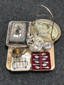 A tray of silver plated entree dish, milk jug, toast rack, boxed set of tea spoons,