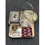 A tray of silver plated entree dish, milk jug, toast rack, boxed set of tea spoons,