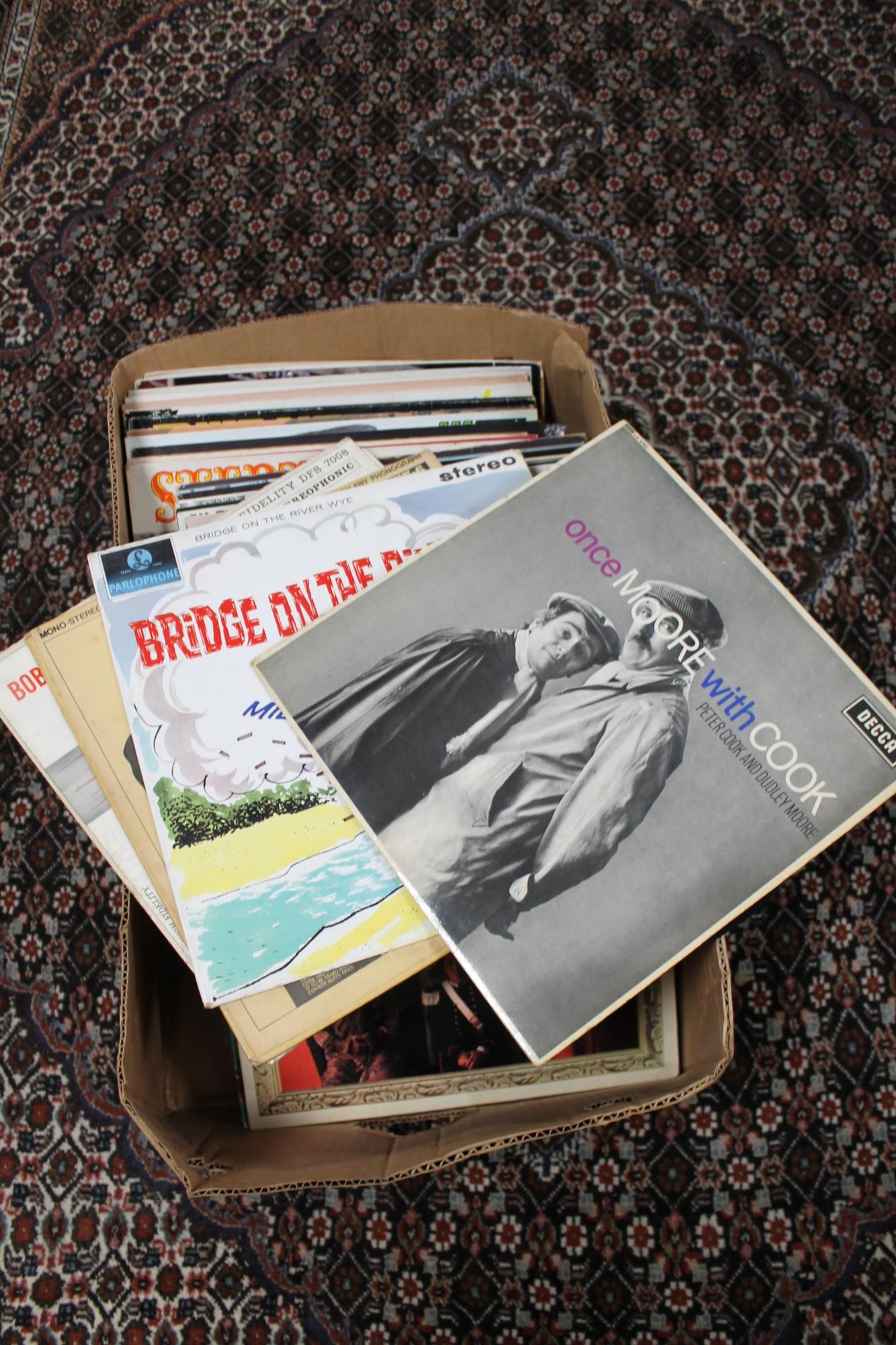 A box of comedy LP's