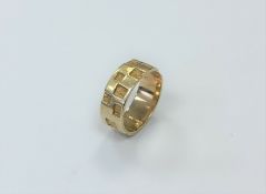 A 9ct gold textured band ring, size P1/2. CONDITION REPORT: 5.