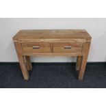 A Sheesham wood two drawer side table