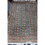 A Tekke design rug on mint ground,