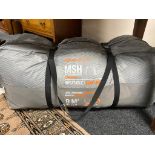A Quechua inflatable 9m square large living room tent in carry bag