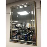A contemporary gilt framed bevelled mirror