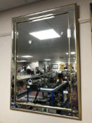 A contemporary gilt framed bevelled mirror