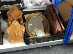 A box of oval gilt mirror, picture frames, leather satchel,