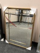 A gold-tone all glass mirror