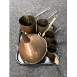 A tray of metal ware, large copper funnel, copper skillets,