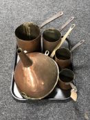 A tray of metal ware, large copper funnel, copper skillets,