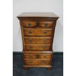 A miniature walnut multi drawer chest CONDITION REPORT: 77cm high by 42cm wide by