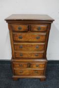A miniature walnut multi drawer chest CONDITION REPORT: 77cm high by 42cm wide by