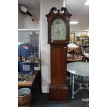 A nineteenth century oak longcased clock with painted dial by Peter Gill,