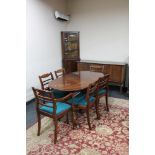 A reproduction mahogany twin pedestal dining table and six chairs