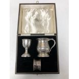 A boxed silver egg cup,
