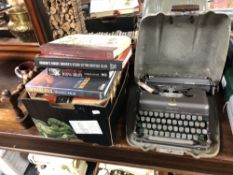 A vintage imperial typewriter in case together with a box of books, book of knowledge,