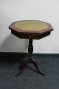 A leather topped occasional table on tripod base
