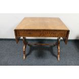 A nineteenth century mahogany flap sided sofa table CONDITION REPORT: Small loss to