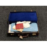 A leather briefcase containing Freemasons regalia