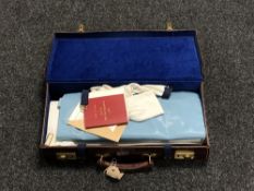 A leather briefcase containing Freemasons regalia