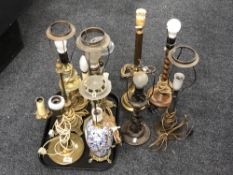 A tray of six continental brass table lamps, porcelain lamp and two others.