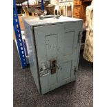 A metal floor safe with key, height 46 cm.
