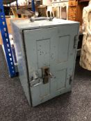 A metal floor safe with key, height 46 cm.