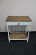 An Edwardian painted single drawer table