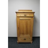 A nineteenth century pine side cabinet fitted with a drawer