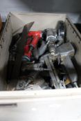 A large crate of power tools, commercial spray guns,