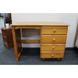 A pine dressing table fitted with four drawers
