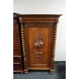 A nineteenth century carved oak side cabinet