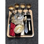 A tray of set of four plated goblets, cased fish servers, silver plated toast rack,