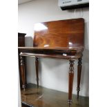 A nineteenth century mahogany tea table CONDITION REPORT: Two areas of damage to
