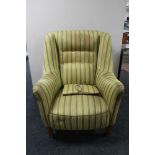 A mid century armchair in two-tone stripe