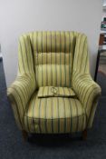 A mid century armchair in two-tone stripe