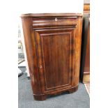 A nineteenth century mahogany corner cabinet