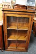 A nineteenth century stained pine glazed bookcase