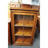 A nineteenth century stained pine glazed bookcase