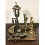 A tray of ornament percussion cap pistol, fire side companion set, two pairs of brass candlesticks,