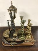 A tray of ornament percussion cap pistol, fire side companion set, two pairs of brass candlesticks,