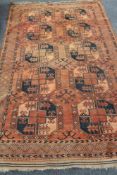 An Afghan Bokhara carpet on red ground,