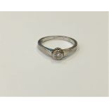 An 18ct white gold solitaire diamond ring, the brilliant cut stone weighing an estimated at 0.