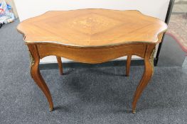 An inlaid walnut ormolu mounted centre table