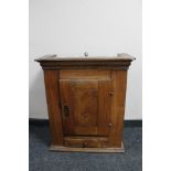 A nineteenth century walnut single door wall cabinet