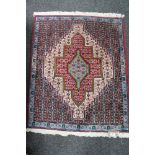 An Persian geometric design rug,