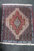 An Persian geometric design rug,